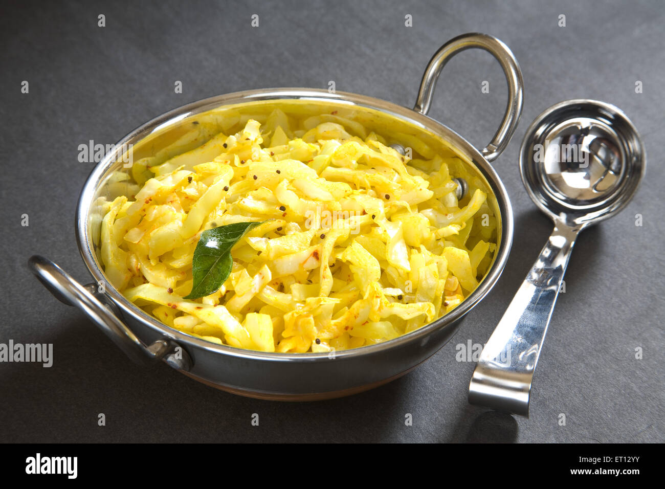 Vegetarian meal ; fry cabbage in pot on grey background 20 May 2010 Stock Photo