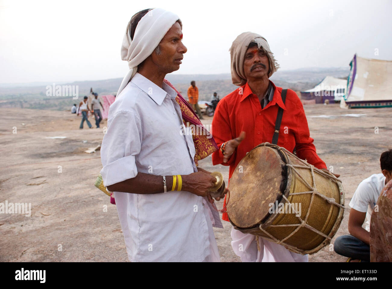 Men singing and playing musical instruments on Mahashivaratri festival at Keesaragutta temple ; Hyderabad ; Andhra Pradesh ; Telengana ; India Stock Photo