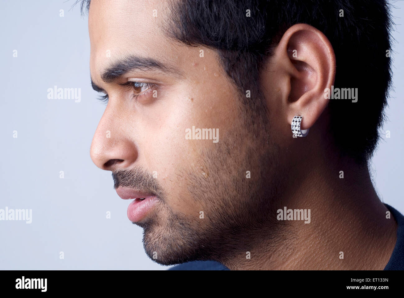 Indian man wearing earring - Model Release#733D Stock Photo