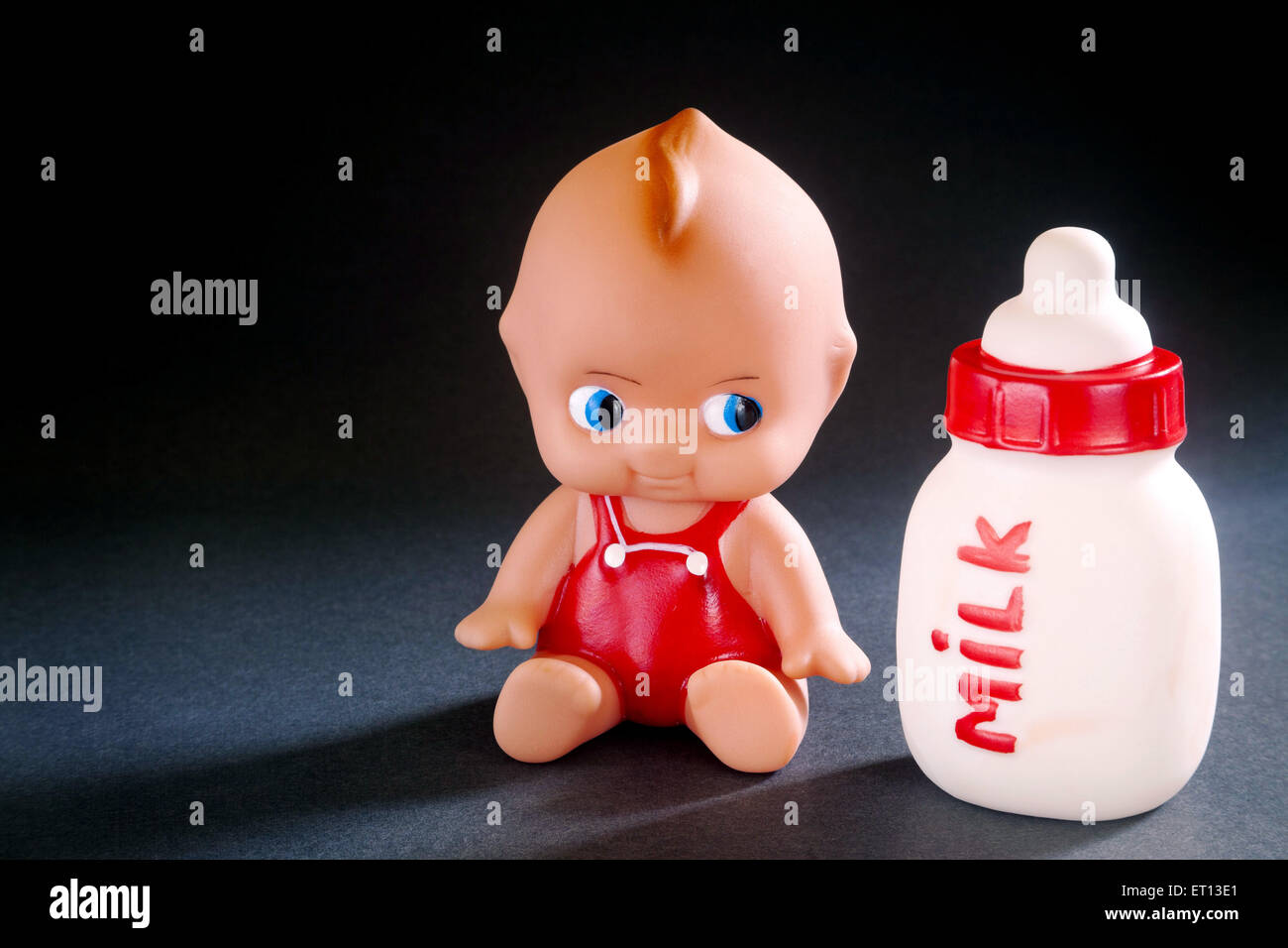 Toy Baby and Milk Bottle made from Rubber India Asia Sept 2011 Stock Photo