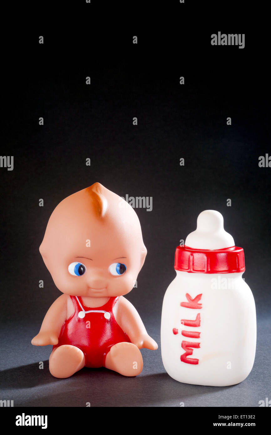 Toy Baby and Milk Bottle made from Rubber India Asia Sept 2011 Stock Photo