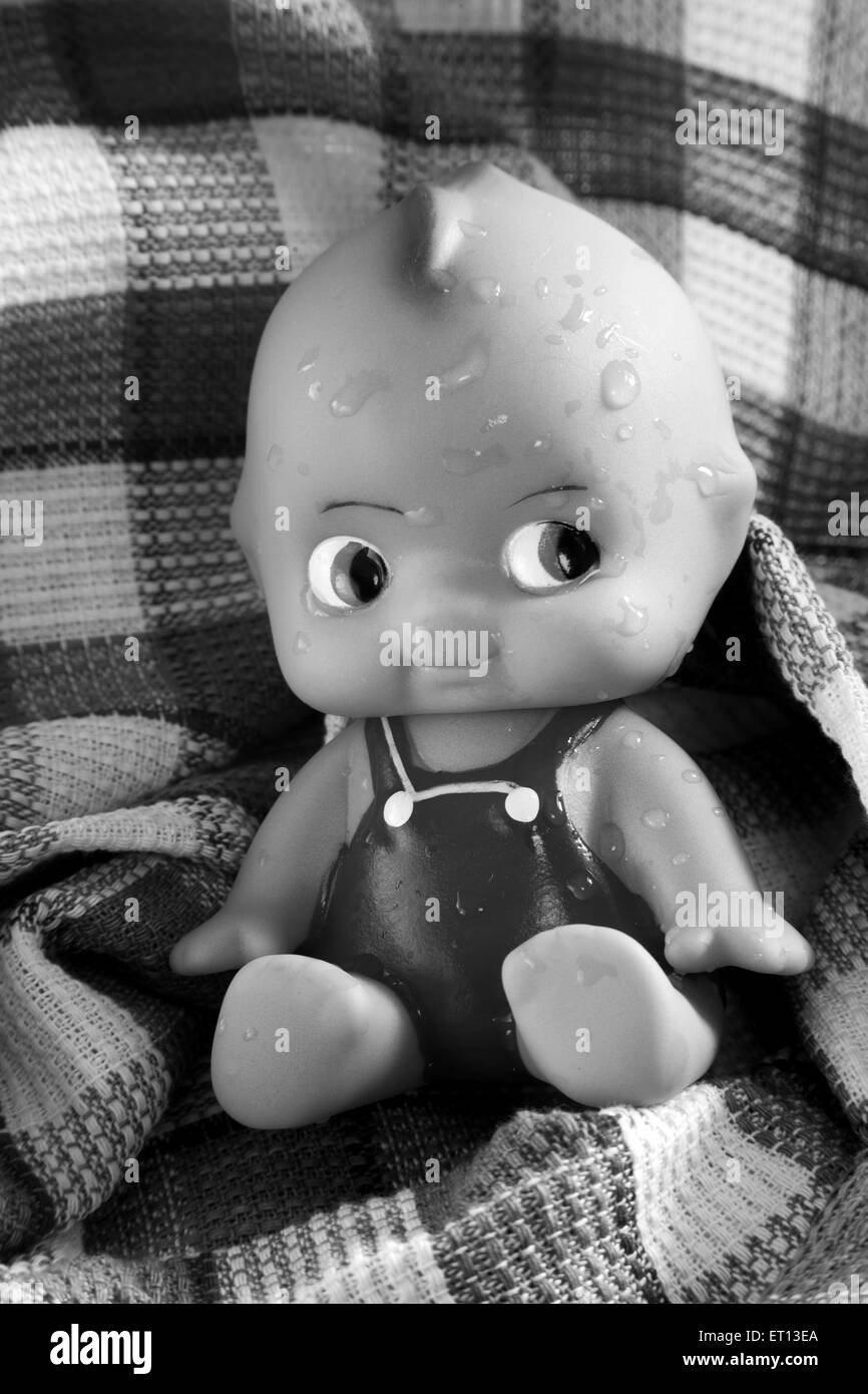 Toy Baby made from Rubber on Cotton fabric Towel India Sept 2011 Stock Photo