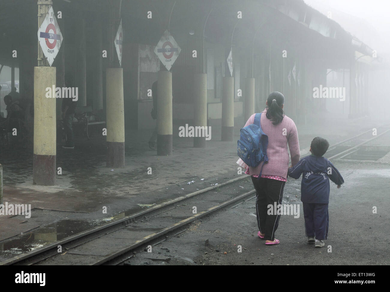 Mother and son at ghum railway station ; Darjeeling ; West Bengal ; India Stock Photo
