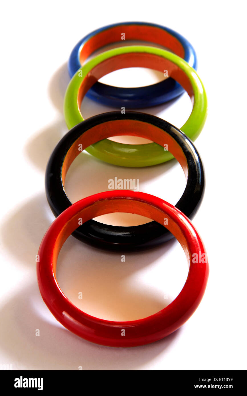 Colorful wooden bangles on white background Stock Photo Alamy
