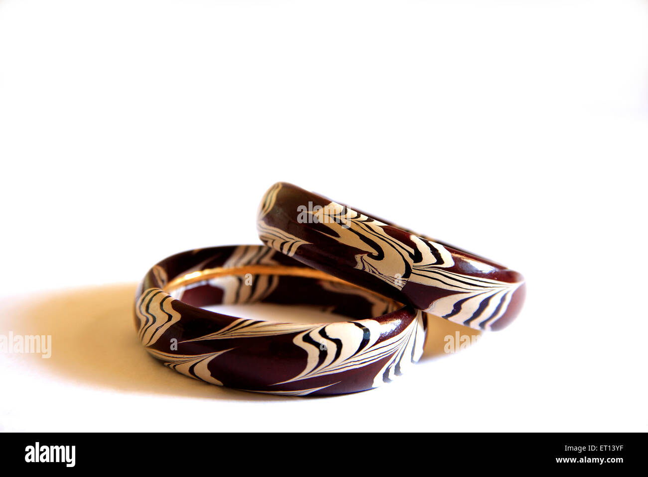 Colorful wooden bangles on white background Stock Photo
