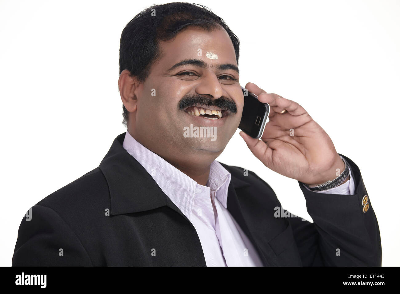 Businessman Talking on Mobile Phone India Asia MR#790E Stock Photo
