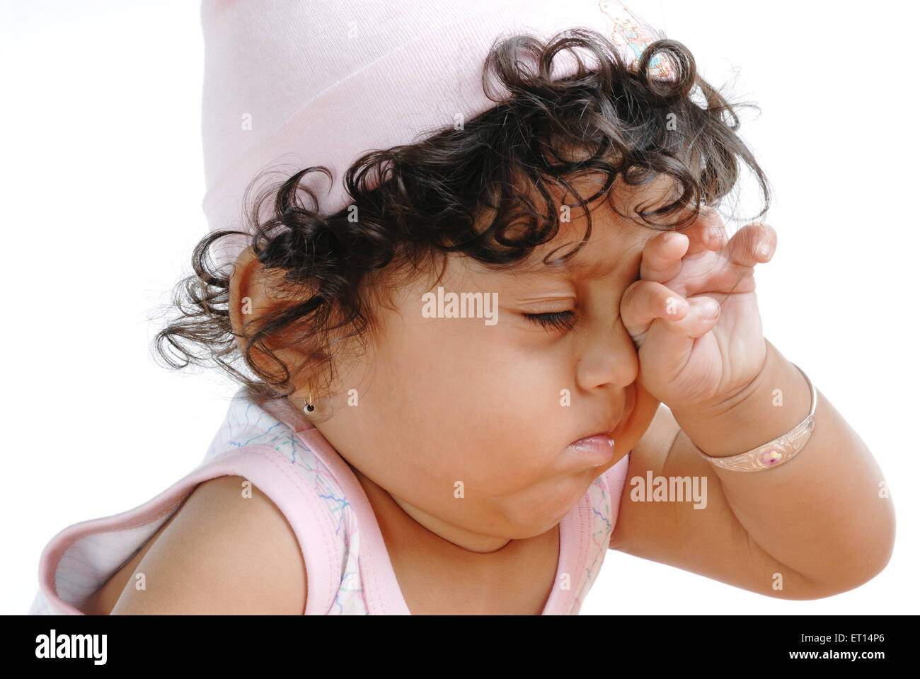 Baby boy rubbing eye MR#719C Stock Photo
