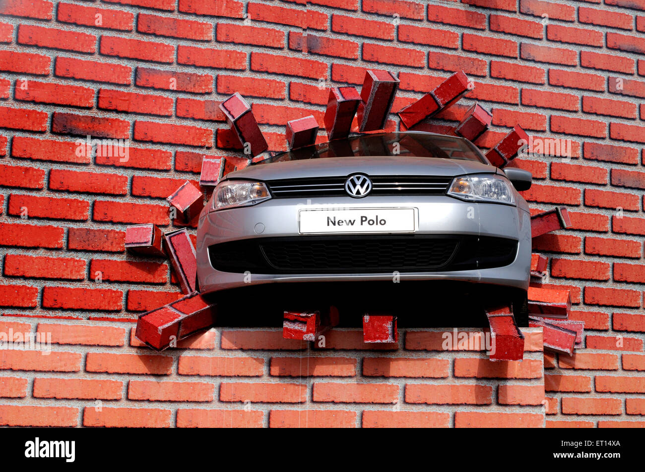 Volkswagen Polo car advertisement billboard design bricks wall Stock Photo