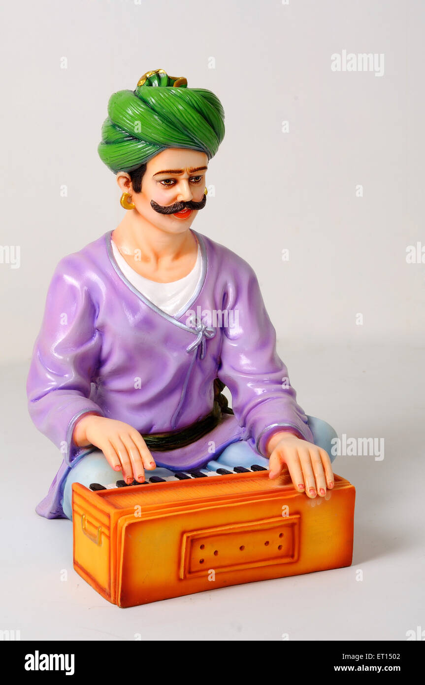 Clay figurine ; statue of rajasthani musician playing harmonium Stock Photo