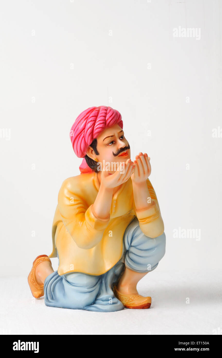 Clay figurine ; statue of rajasthani man posing for drinking water Stock Photo