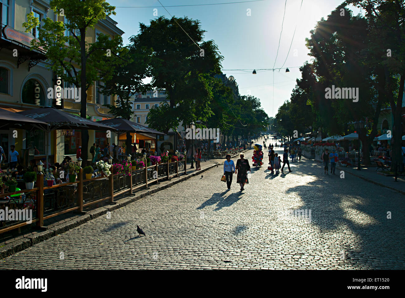 People walking on Deribasovskaya street at sunset Stock Photo
