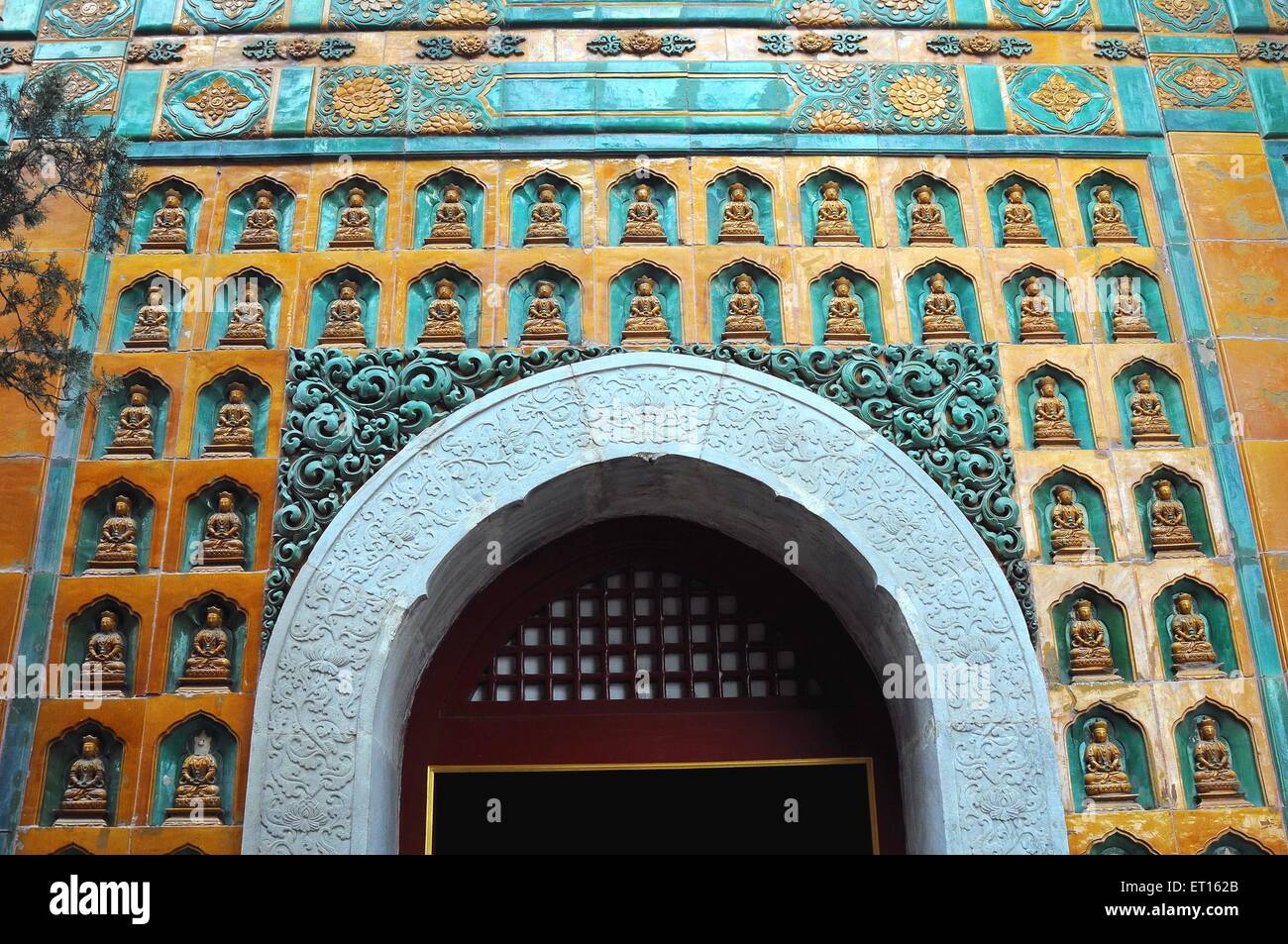 Entrance of buddhist temple duo bao glazed pagoda near Summer palace ; Beijing ; China Stock Photo