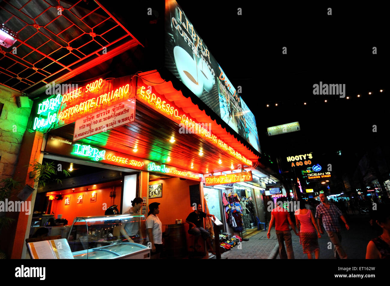 Night life and neon signs of coffee shops and nightclubs at Walking Street ; Pattaya Island ; Thailand Stock Photo