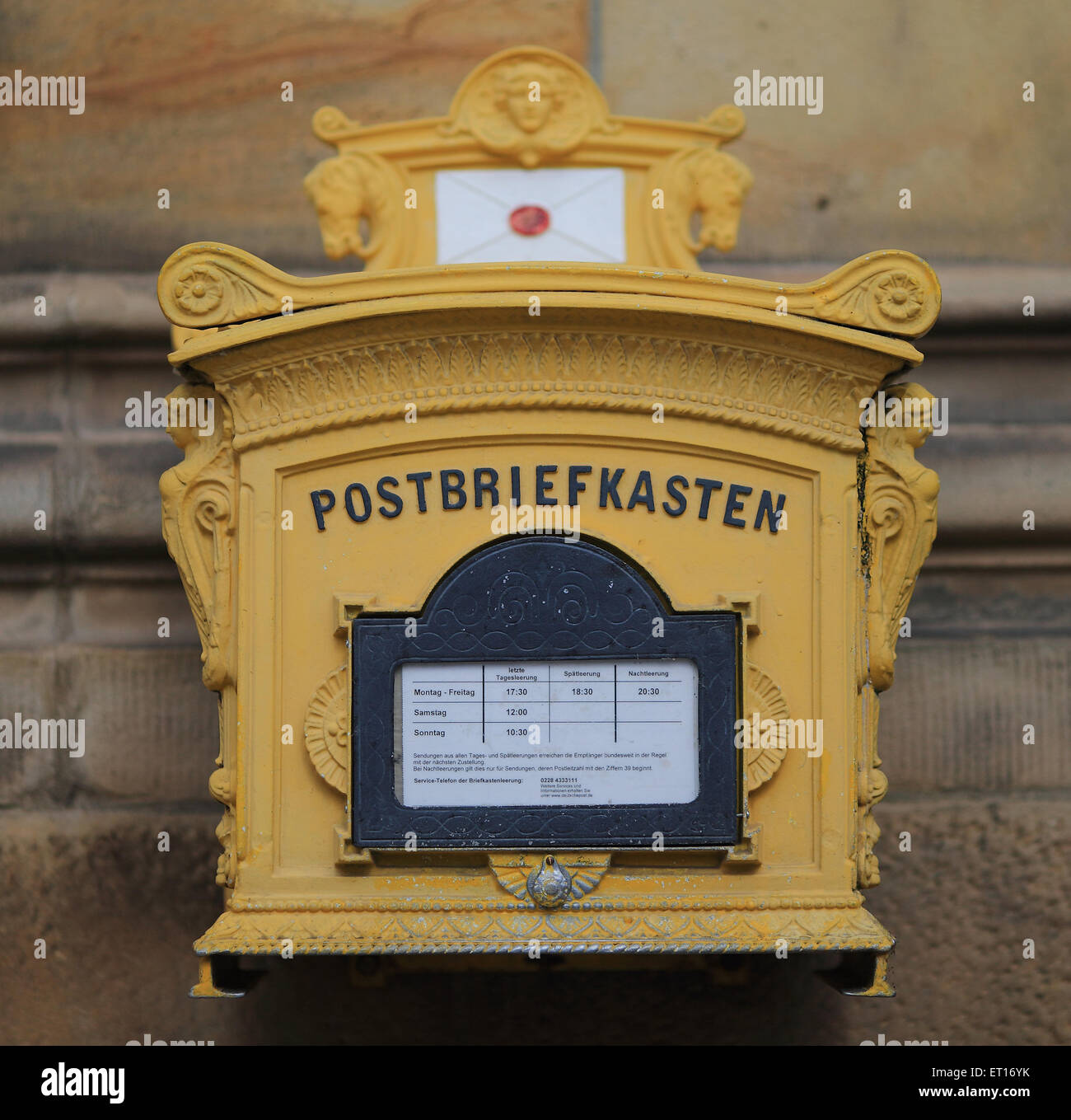 An mailbox of Deutsche Post AG in Magdeburg, Germany, 10 June 2015. German labour union Verdi has called Deutsche Post employees to an open-ended strike. PHOTO: JENS WOLF/dpa Stock Photo