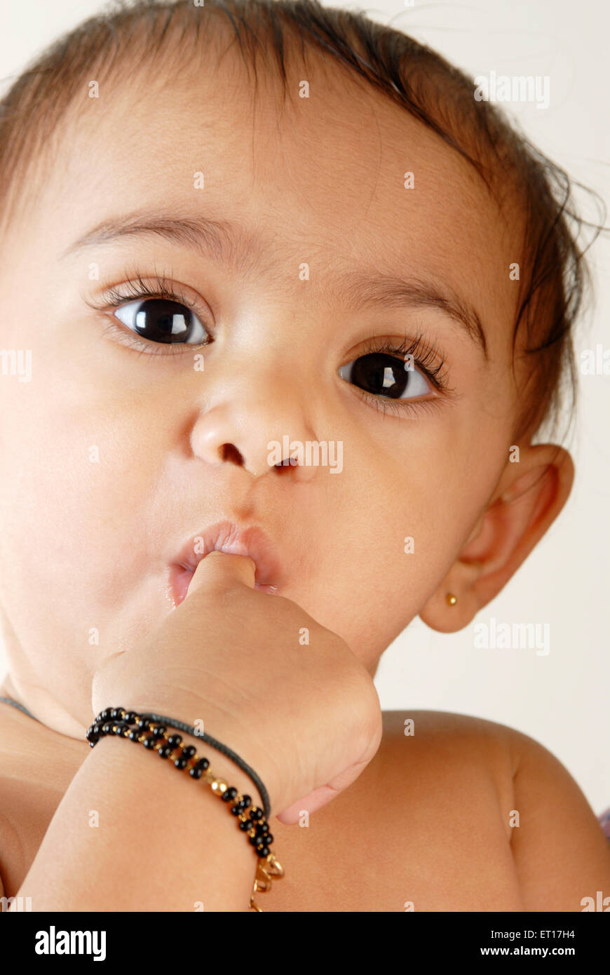 Baby boy sucking finger MR#152 Stock Photo