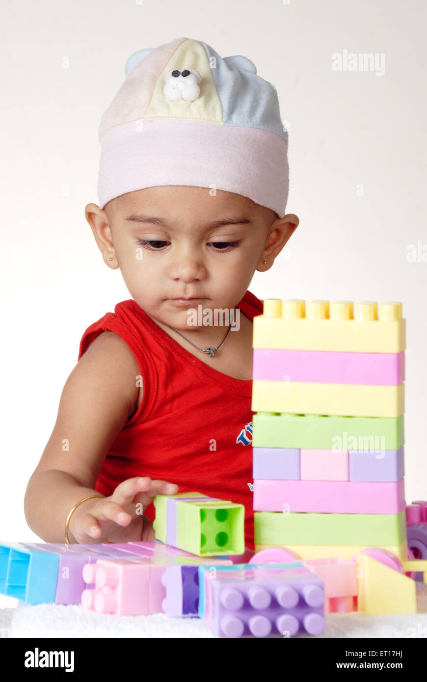 Baby boy playing with plastic construction toy MR#512 Stock Photo