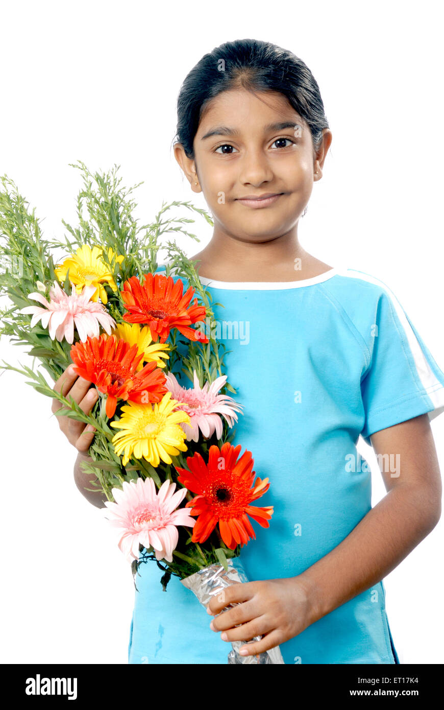Girl holding flower bouquet and celebrating occasion ; Bombay Mumbai