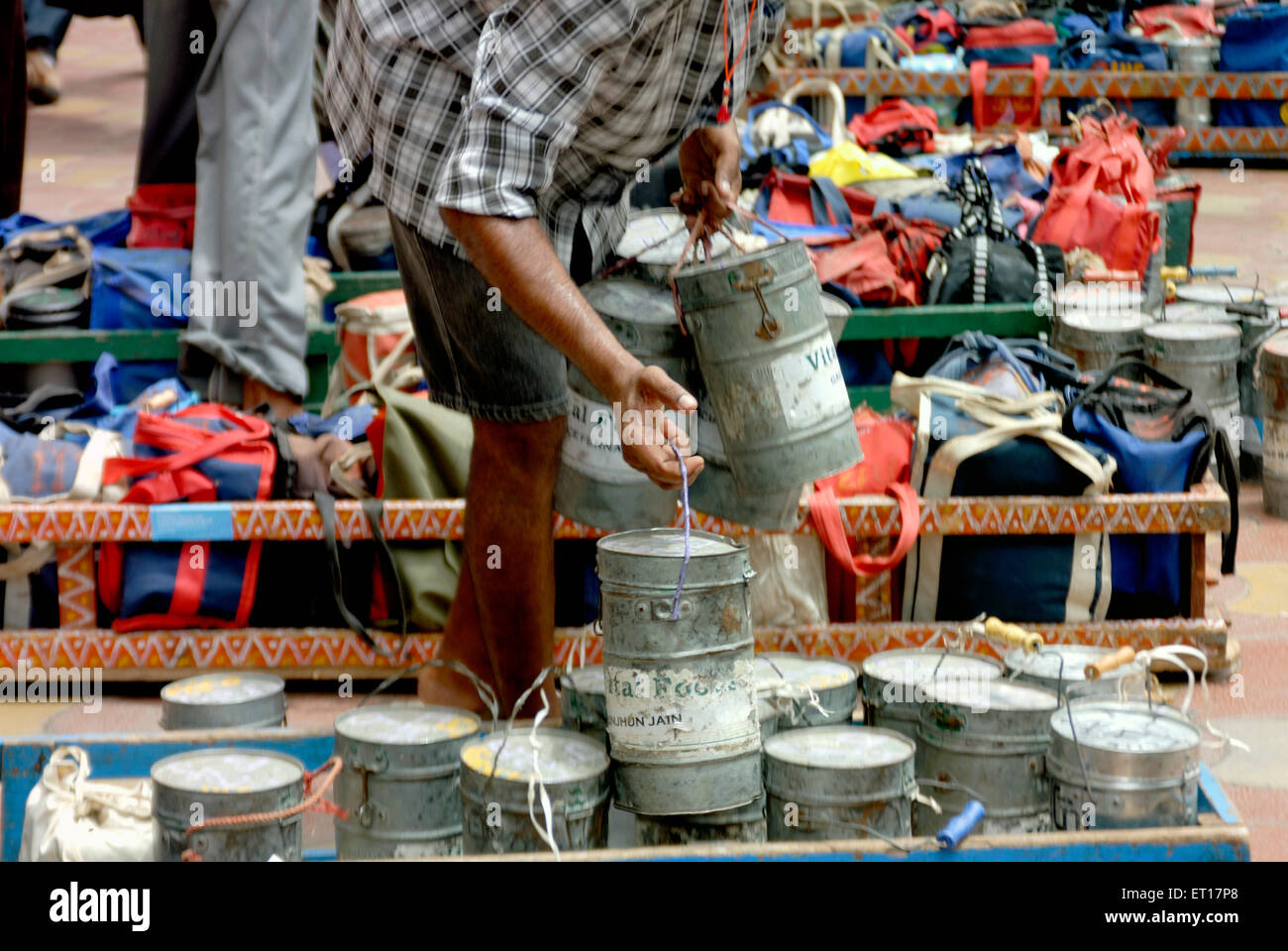 Tiffinwala dabbawala deliveryman with lunch boxes ; Bombay ; Mumbai ; Maharashtra ; India ; Asia Stock Photo