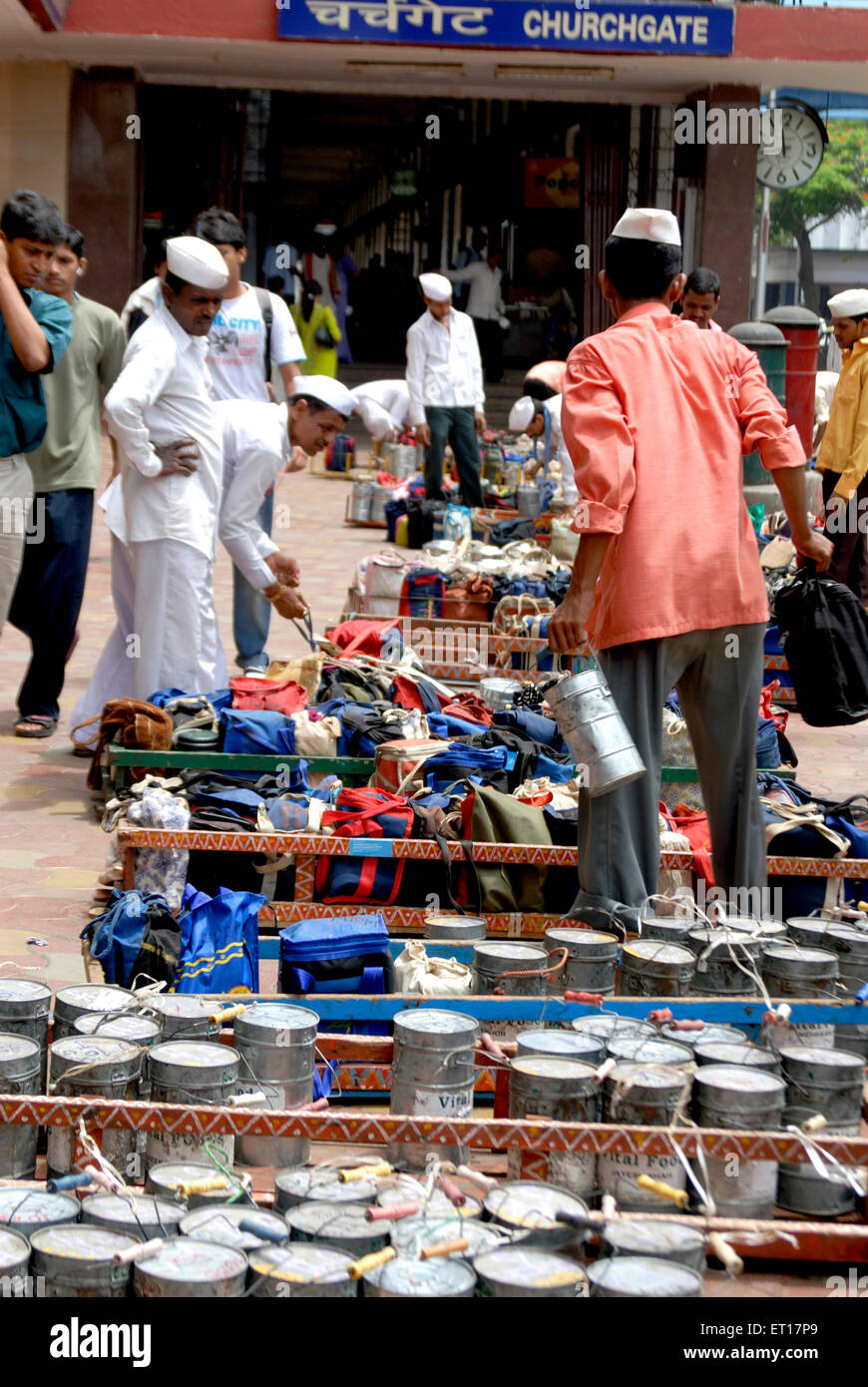 Tiffinwala dabbawala deliveryman carrying lunch boxes ; Bombay ; Mumbai ; Maharashtra ; India ; Asia Stock Photo