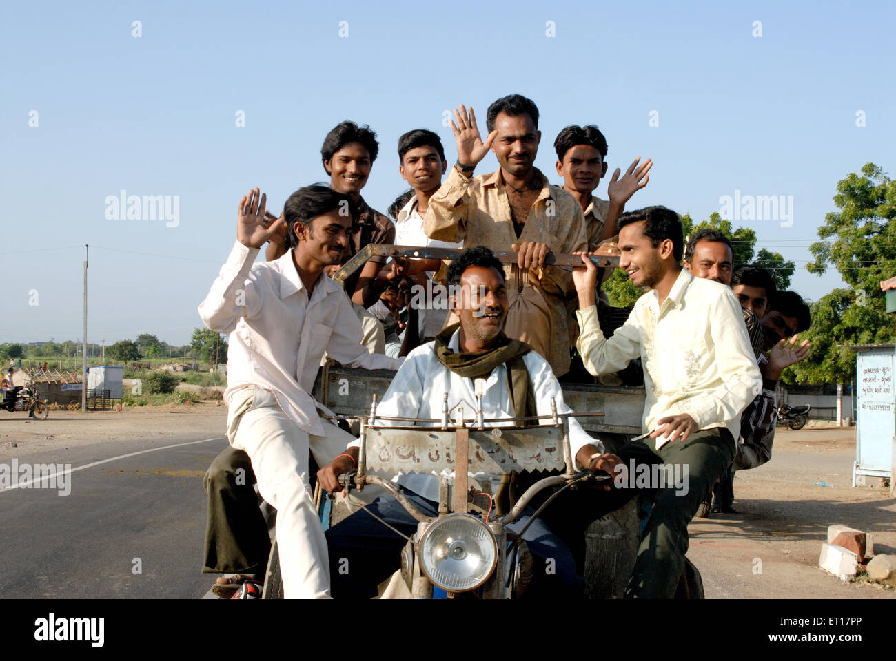 Ten men traveling on one auto rickshaw taxi, Amreli, Gujarat, India,  MR#364 Stock Photo