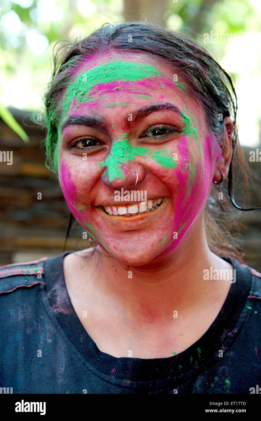 Indian girl face smeared with colors Holi Festival India -  MR#364 - RMM 178235 Stock Photo