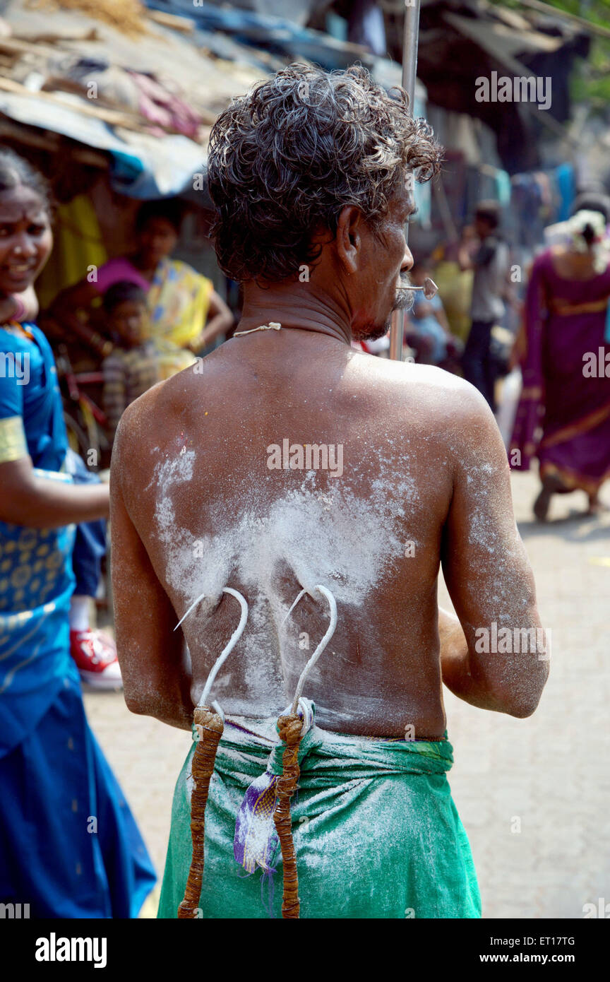 Man pulling on hook Murugan festival Ayyappa Mumbai Maharashtra India Asia Stock Photo