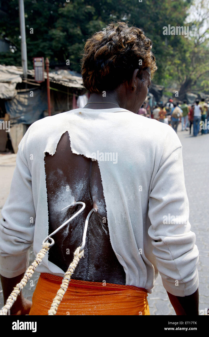 Man pulling on hook Murugan festival Ayyappa Mumbai Maharashtra India Asia Stock Photo