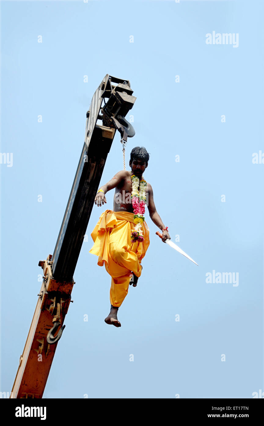 Man hanging on hook Murugan festival Ayyappa Mumbai Maharashtra India Asia Stock Photo