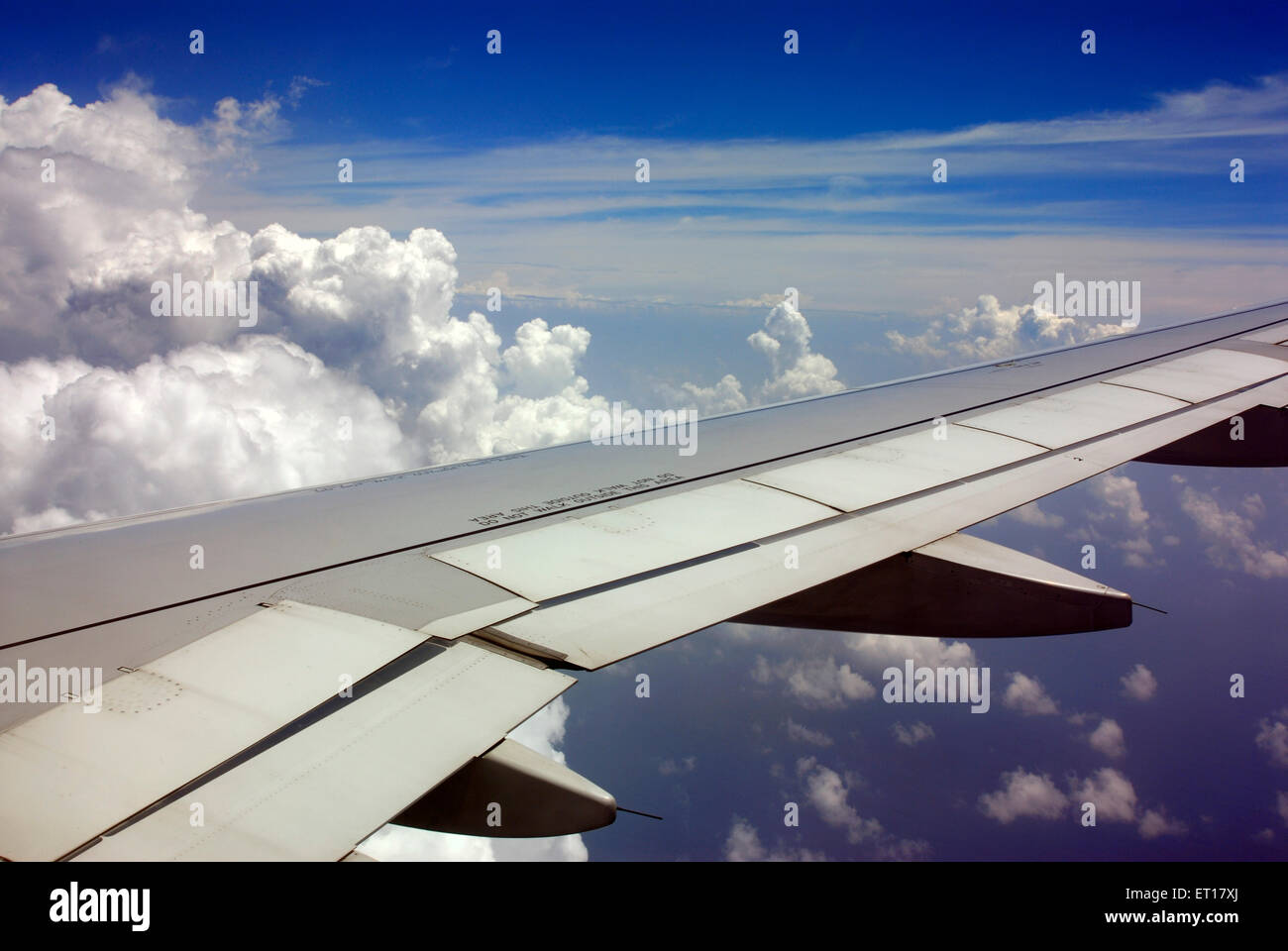 Aerial view of aeroplane wing in blue sky Stock Photo - Alamy