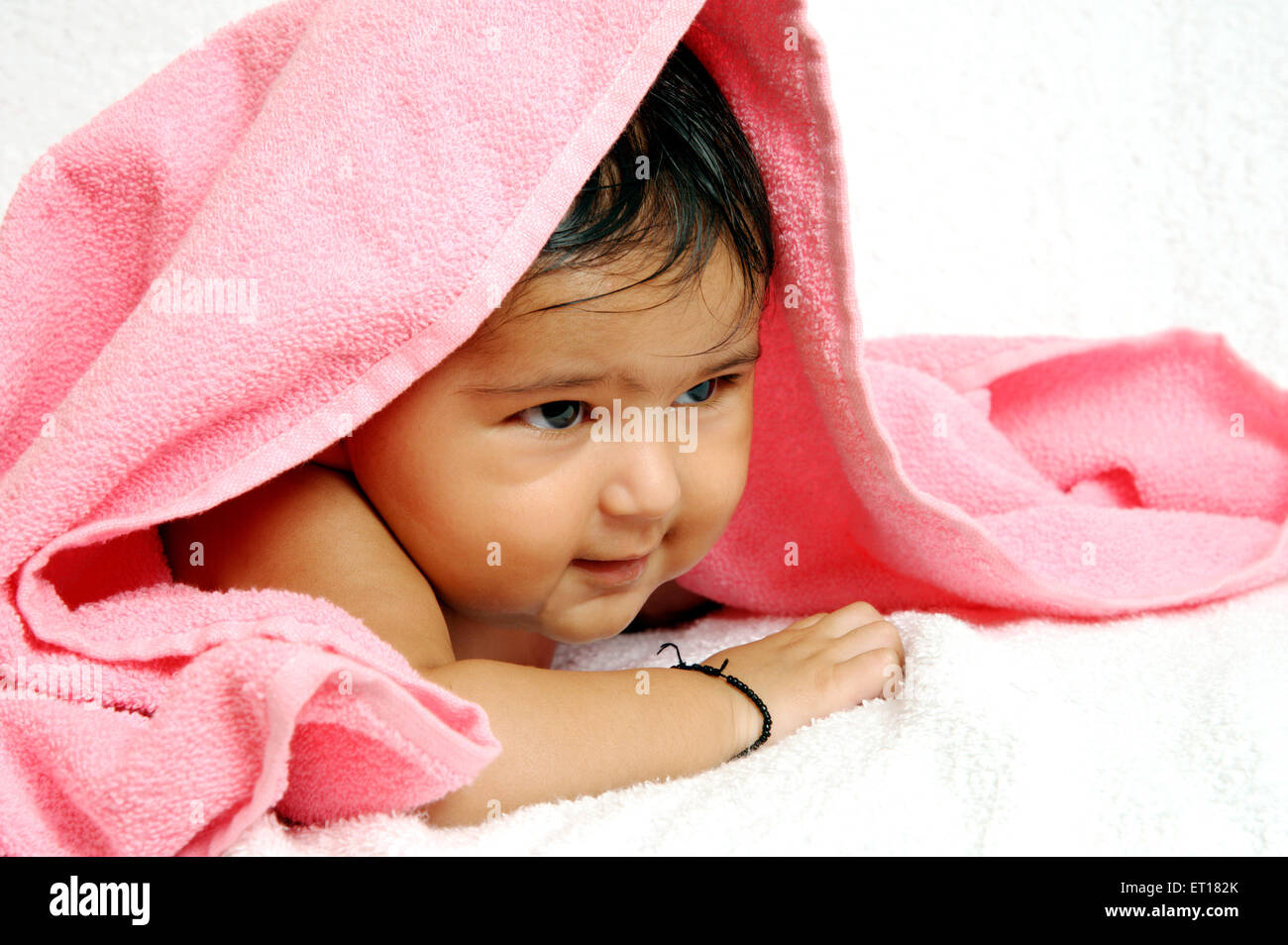 Three months Indian Baby boy Lying with Towel MR#784F Stock Photo