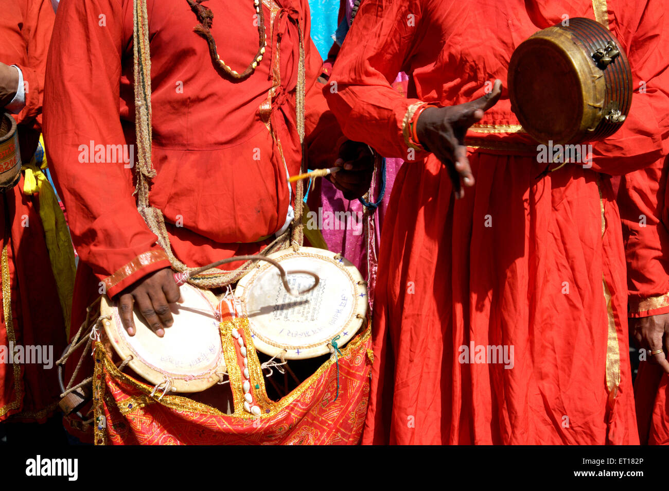 Men playing folk musical instruments drums, India Stock Photo