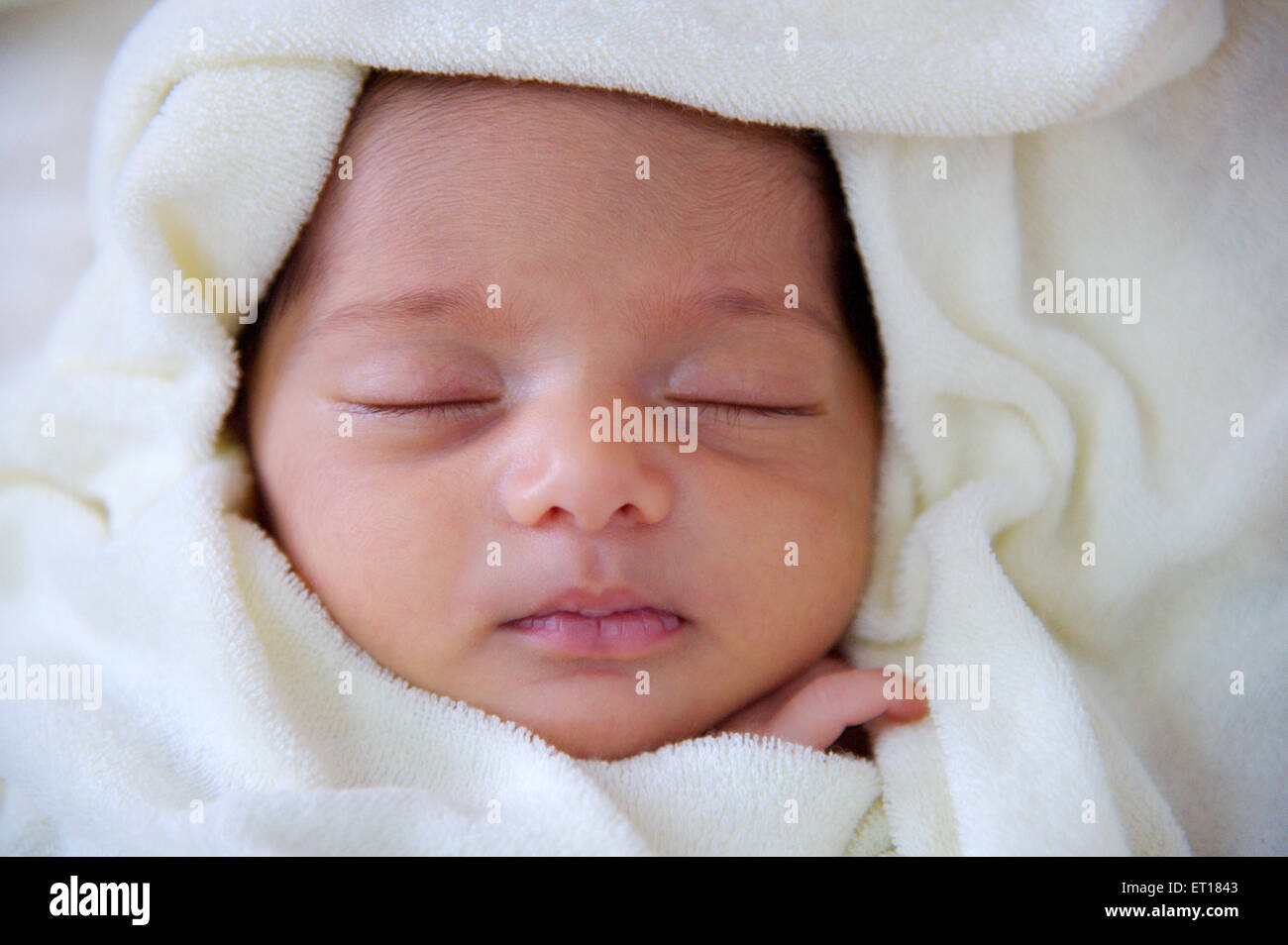 Baby sleeping on white background - MR#736LA Stock Photo