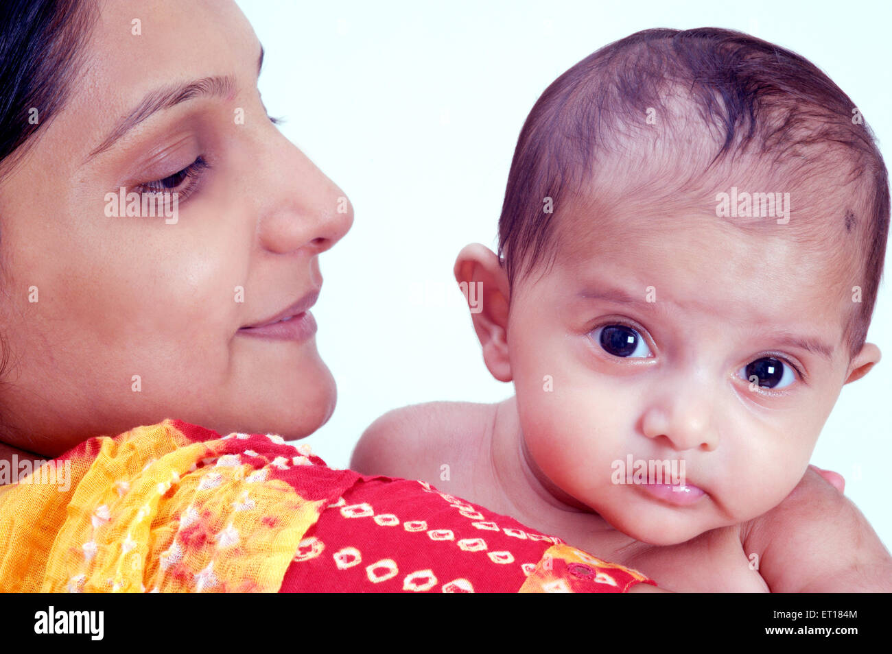 Indian Mother Child faces close up - MR#736K and MR#736LA Stock Photo