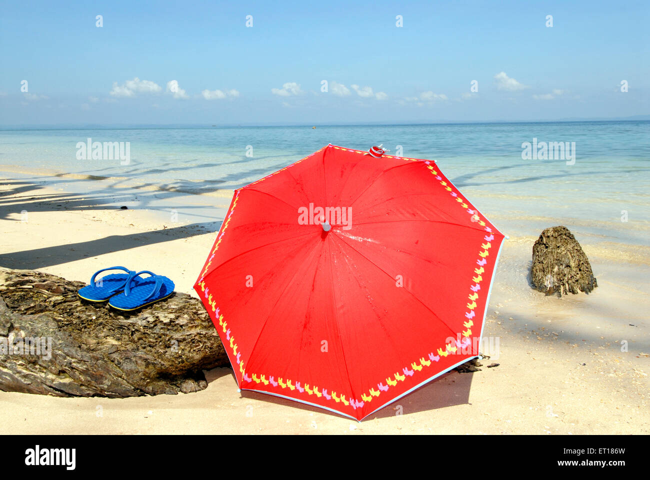 Red umbrella and blue slipper, Radhanagar beach, Havelock Island, Port Blair, Andaman and Nicobar Islands, Union territory of India, UT, India, Asia Stock Photo