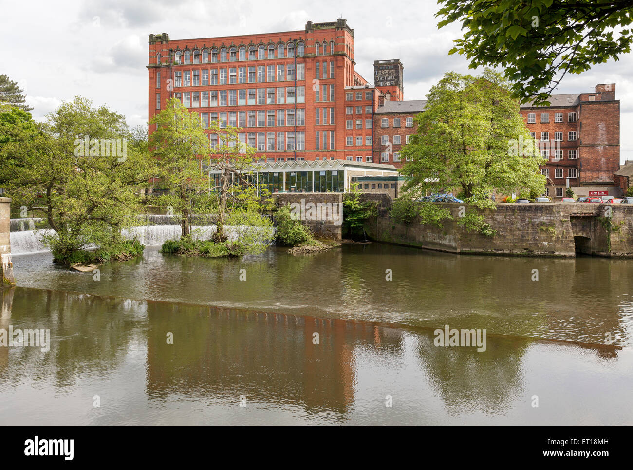 Belper East Mill and weir, Derbyshire, England Stock Photo