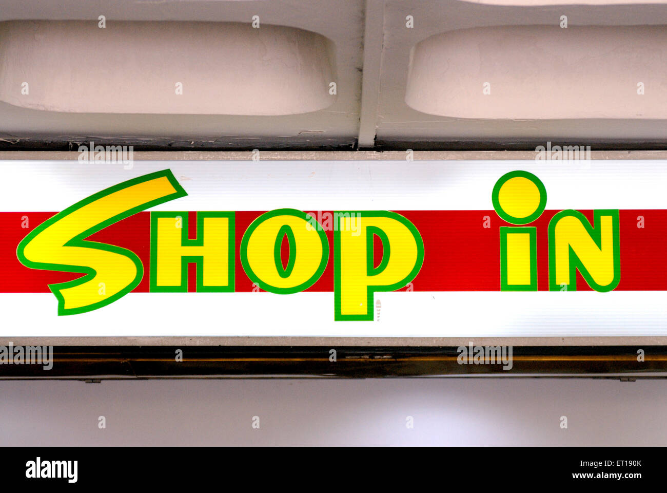 shop in sign, red yellow signage Stock Photo