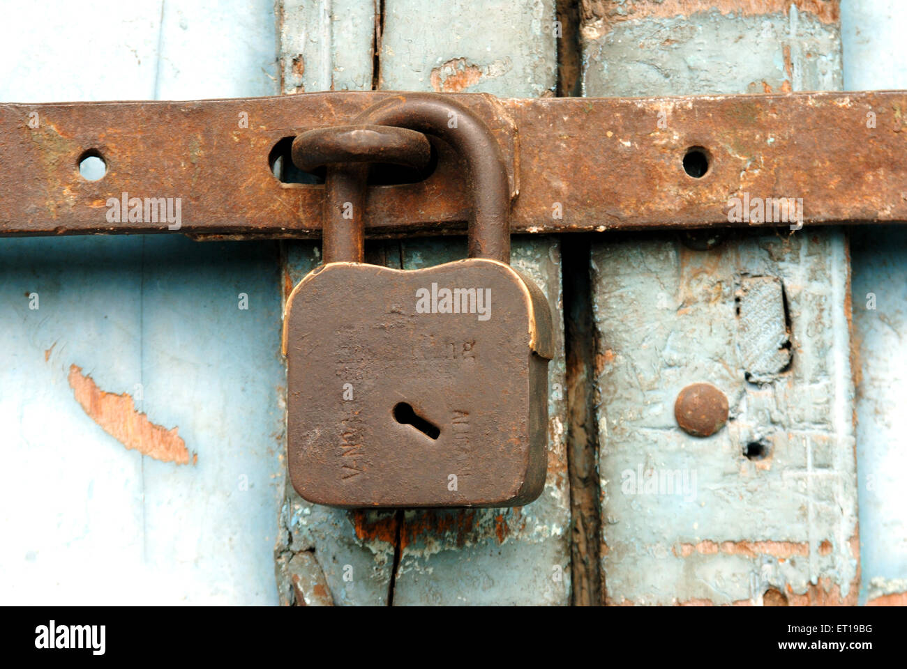Old lock on door, closed door Stock Photo