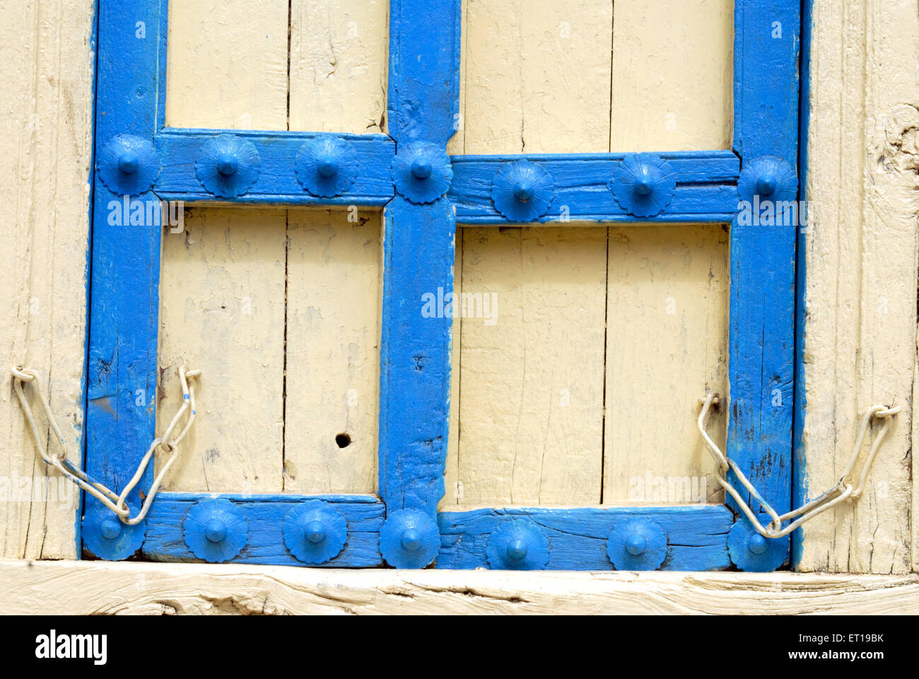 Closed old wooden door painted blue, India Stock Photo