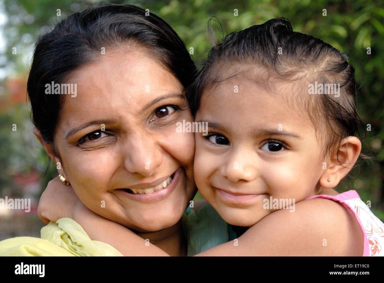 Mother and daughter hugging MR#736K;736L Stock Photo