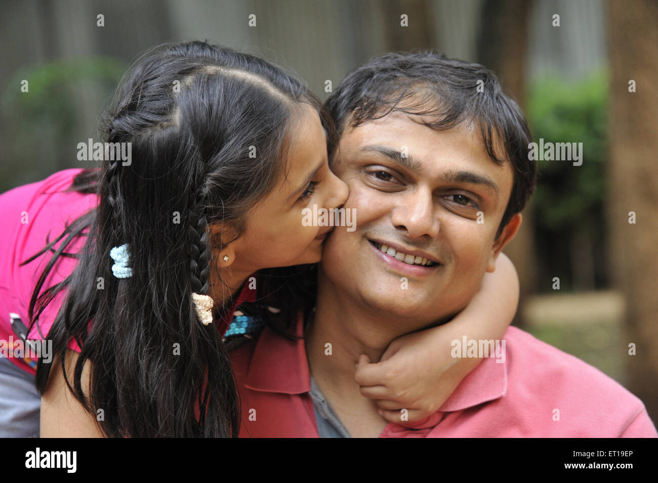 Indian Daughter Kissing Father MR#364 Stock Photo
