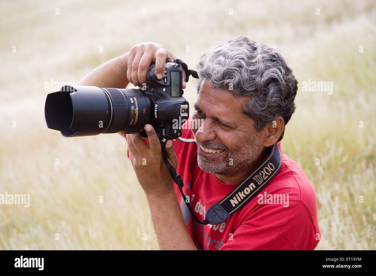 Photographer ; Ravi Shekhar with camera ; Nandur ; Marathwada ; Maharashtra ; India ; MR#202 Stock Photo