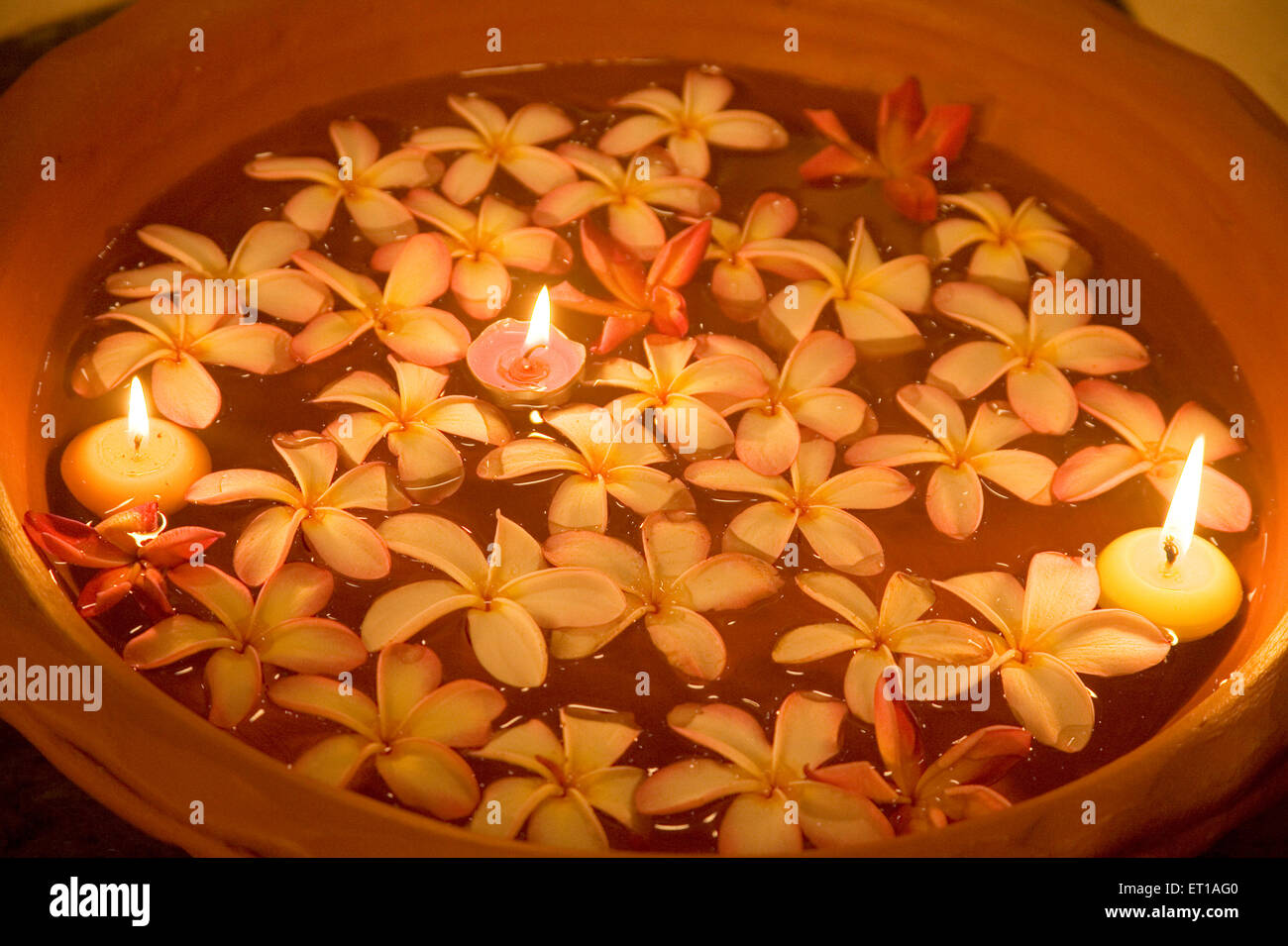 Flowers and candle light floating on water in a Spa ; Palolem beach ; Goa ; India Stock Photo