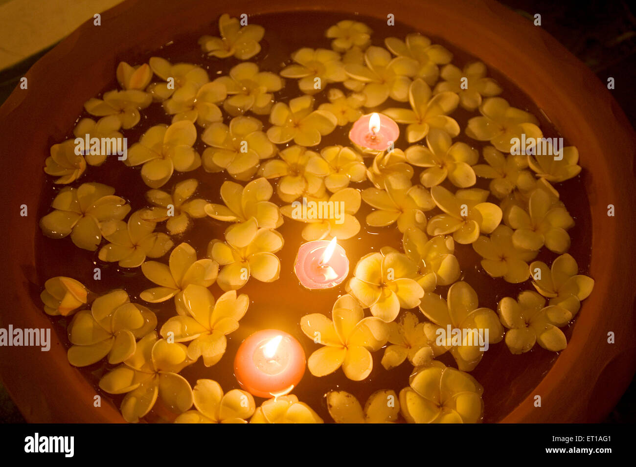 Flowers and candle light floating on water in a Spa ; Palolem beach ; Goa ; India Stock Photo