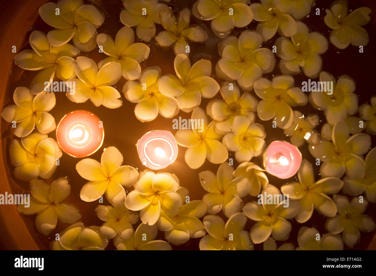 Flowers and candle light floating on water in a Spa ; Palolem beach ; Goa ; India Stock Photo