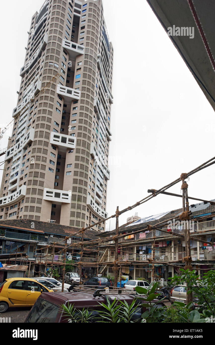 Chawl with High Rise Building skyscraper old new then now rich poor Bombay Mumbai Maharashtra India Asia Stock Photo