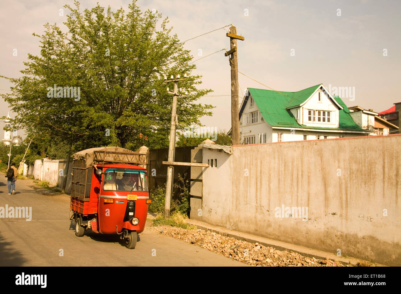 Auto rickshaw carrying goods ; Srinagar ; Kashmir ; Jammu and Kashmir ; India ; Asia Stock Photo
