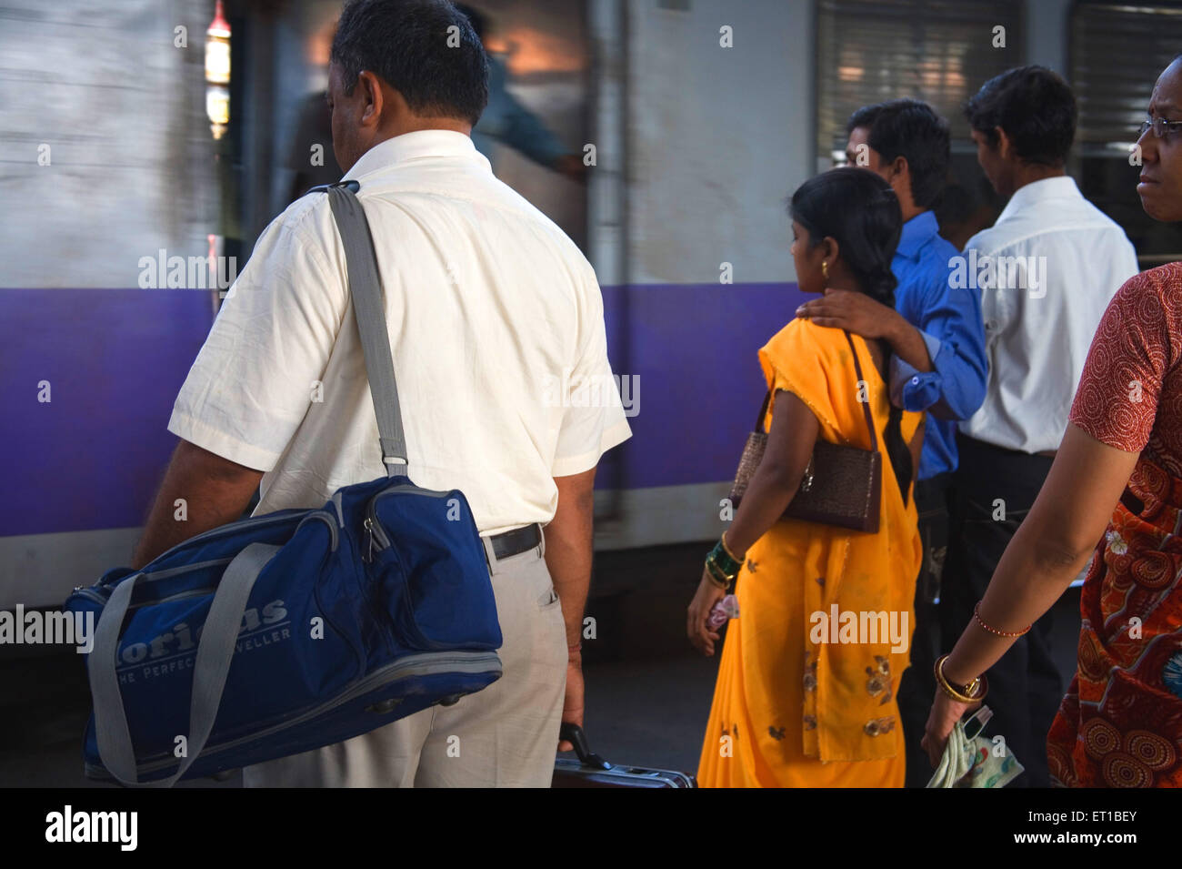 Commuters waiting for local suburban train ; Borivali railway station ; Bombay ; Mumbai ; Maharashtra ; India Stock Photo