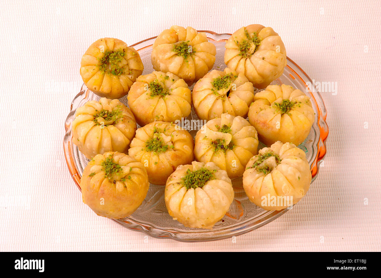 Sweet ; tavapuri served in plate on white background ; Jodhpur ; Rajasthan ; India Stock Photo