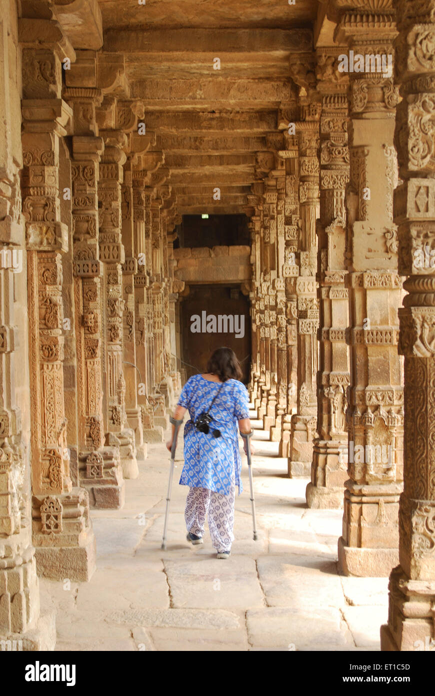 Handicapped lady walking in gallery in Qutab Minar campus ; Delhi ; India Stock Photo
