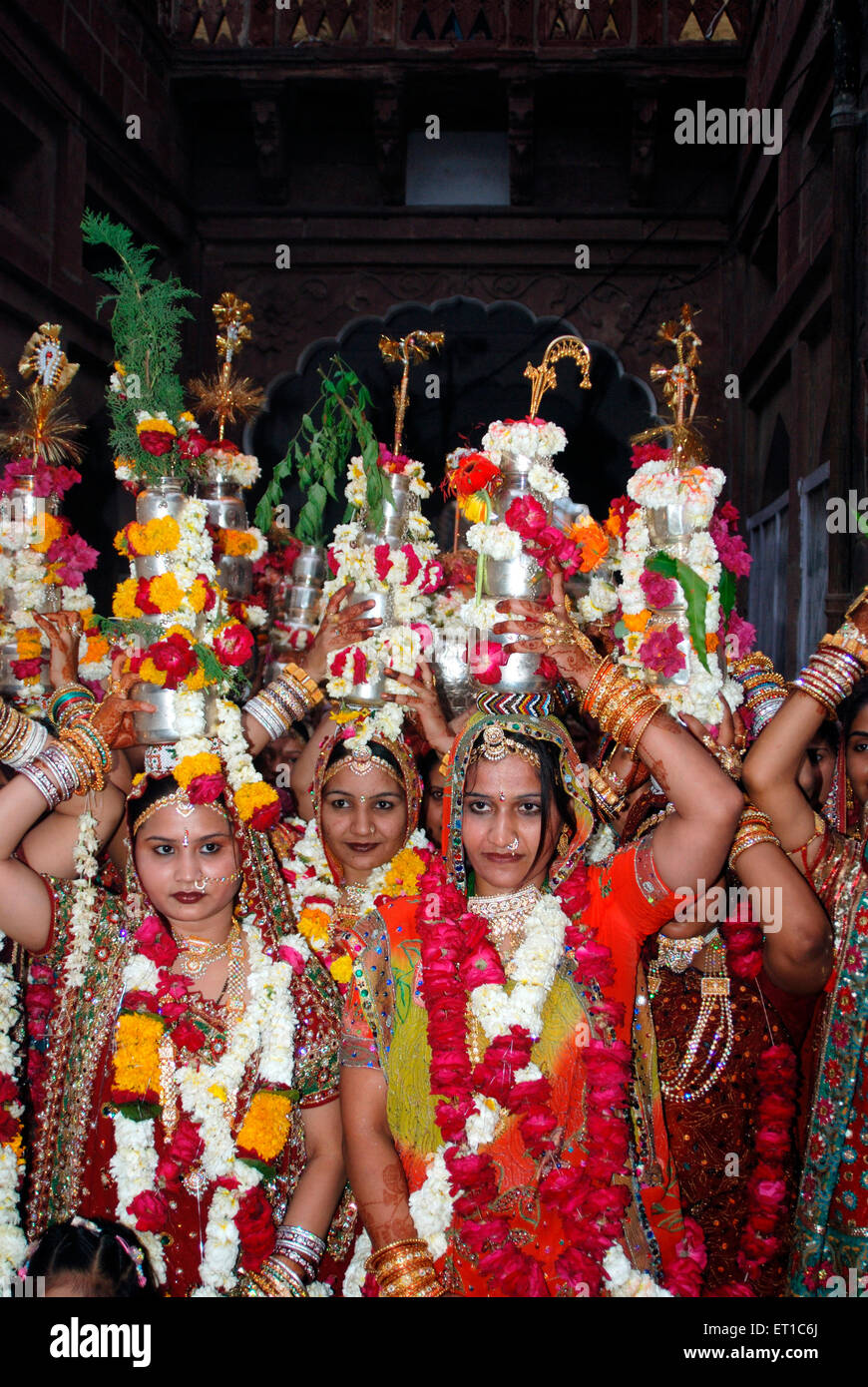 Rajasthani marwari women in traditional dress and ornaments with silver Lotiyan on their heads ; Jodhpur Stock Photo